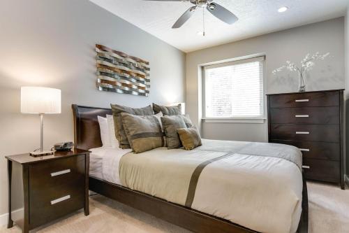 a bedroom with a bed with a dresser and a window at Ski Haven in Salt Lake at Base of Big Cottonwood in Cottonwood Heights