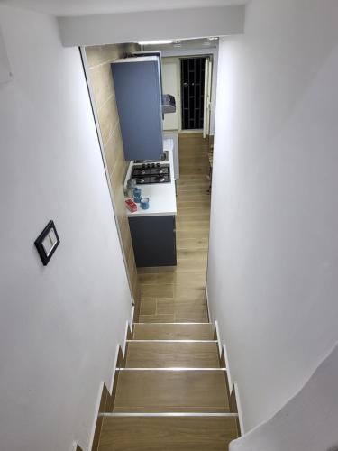 a stairway leading up to a kitchen with a stove at L'Approdo di Dante in Naples
