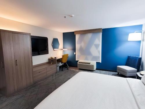 Ένα ή περισσότερα κρεβάτια σε δωμάτιο στο Holiday Inn Express Enid-Highway 412 by IHG