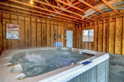a hot tub in a room with wooden walls at Urban Central in Salt Lake with Indoor Hot Tub in Salt Lake City