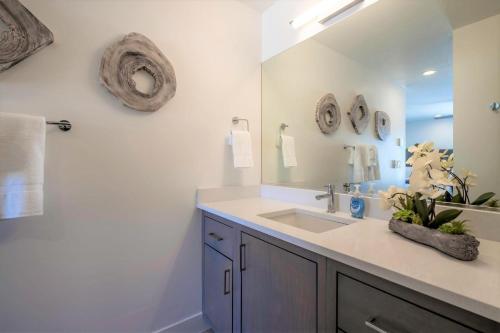 a bathroom with a sink and a mirror at 19| Vue at Green Valley with Community Pool in St. George