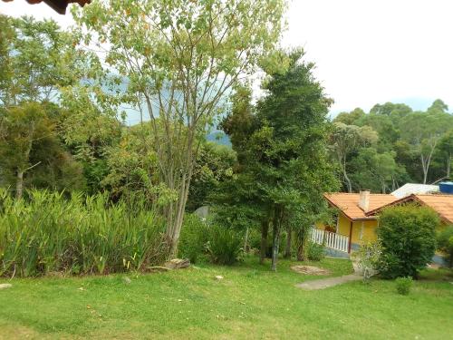Taman di luar CHALES Canto dos Pássaros