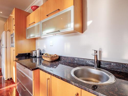 a kitchen with a sink and a counter top at Dock Point 1 in Durban