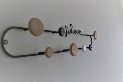 a drumstick wall mount with at Seaside Serenity - A lovely apartment with views in Mellieħa