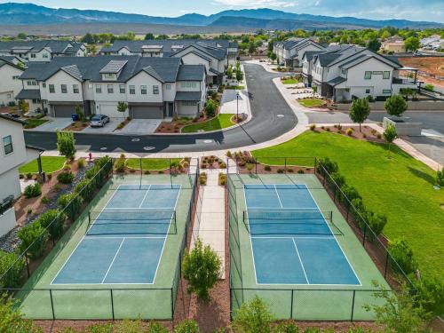 an aerial view of tennis courts in a residential neighborhood at 30 | Poolhouse at Ocotillo Springs with Private Pool and Views in Santa Clara