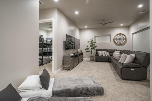 a living room with a couch and a television at 30 | Poolhouse at Ocotillo Springs with Private Pool and Views in Santa Clara