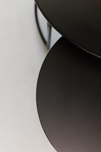 a close up of a table with a black stool at No Stars - Premium Hotel Apartments in Ioannina