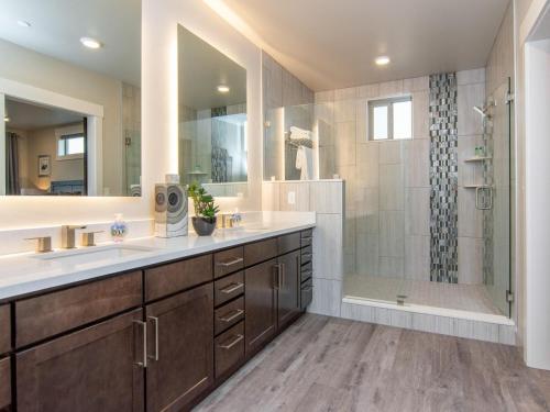 a bathroom with two sinks and a shower at Sage Creek E1 in Moab with Scenic Community Pool in Moab