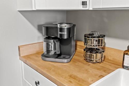 a coffee maker on a wooden counter in a kitchen at The Luxe/ Hot Tub/ On Bright Leaf Golf Course in Harrodsburg
