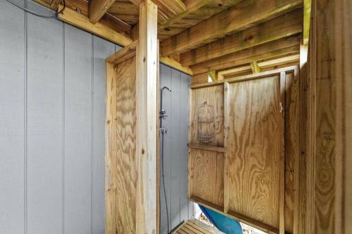 a room with wooden walls and a wooden door at The Grey Goose in Duck