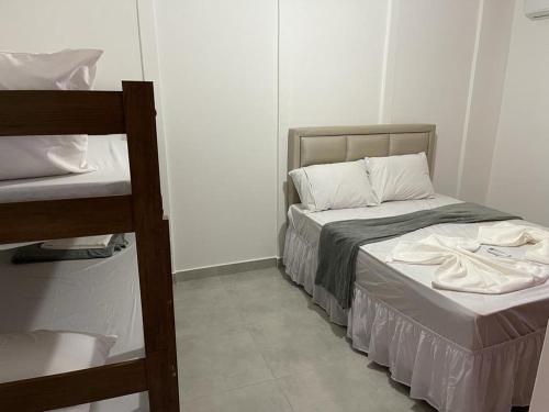 Ένα ή περισσότερα κρεβάτια σε δωμάτιο στο Pousada Casa Serra Alves ll