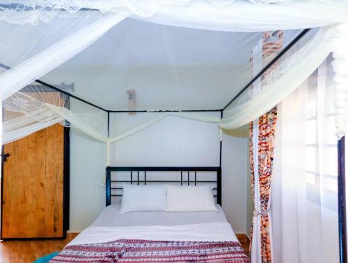 מיטה או מיטות בחדר ב-Ivy Homes