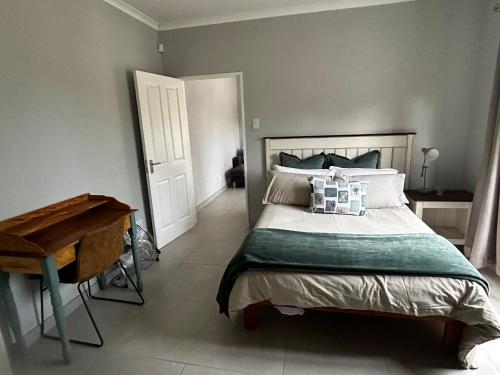 a bedroom with a bed and a piano in it at Self contained flat in Sandton