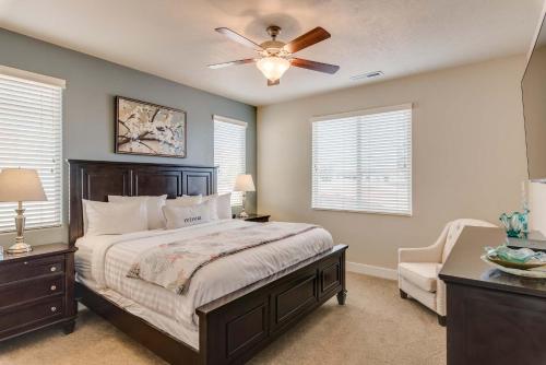 a bedroom with a bed and a ceiling fan at 5-7 | 3 Homes in St. George with Covered Patio Views in Santa Clara