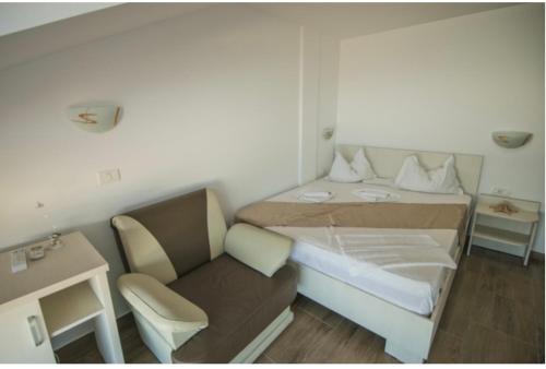 En eller flere senge i et værelse på Complex Turistic Perla Venusului