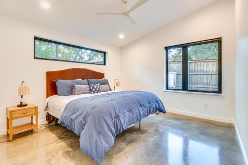 a bedroom with a bed and two windows at Chic Austin Guest Suite 3 Mi to Downtown in Austin