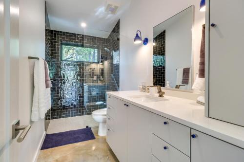 a bathroom with a shower and a toilet and a sink at Chic Austin Guest Suite 3 Mi to Downtown in Austin