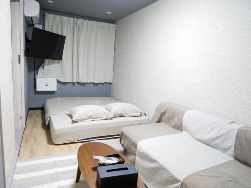 Ένα ή περισσότερα κρεβάτια σε δωμάτιο στο HOOD - Vacation STAY 46025v
