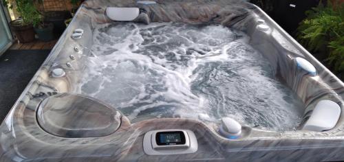 a jacuzzi tub with water in it at Rockin B RV 