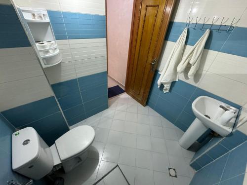 a bathroom with a toilet and a sink at B 2 bedroom apartment in Fez
