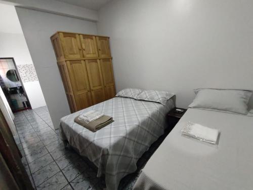 Ένα ή περισσότερα κρεβάτια σε δωμάτιο στο Apartamentos aconchegante Aki
