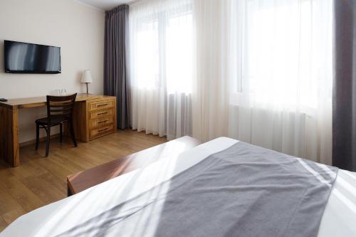 Postel nebo postele na pokoji v ubytování Monte Hotel