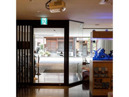 an open door to a lobby with a building at Kanazawa Station Hotel - Vacation STAY 36365v in Kanazawa