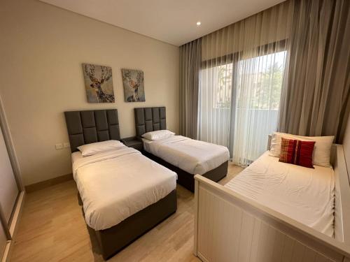 Postel nebo postele na pokoji v ubytování Hawana Salalah Villa