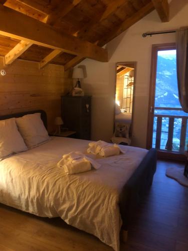 Ένα ή περισσότερα κρεβάτια σε δωμάτιο στο Chalet Mariabel Vue panoramique