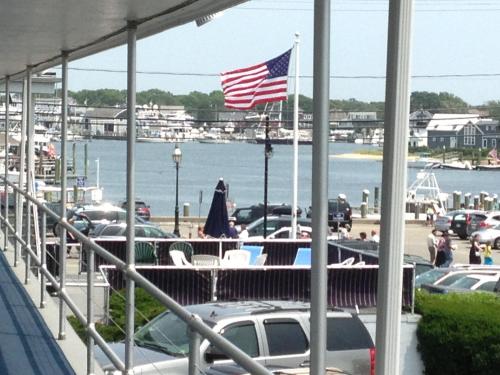 a view of a marina with an american flag at Ocean Street Inn in Hyannis