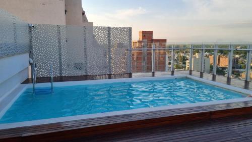 a swimming pool on the roof of a building at Home in Río Cuarto