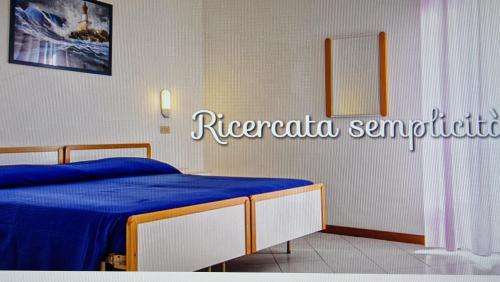 En eller flere senger på et rom på Hotel Saint Raphaele
