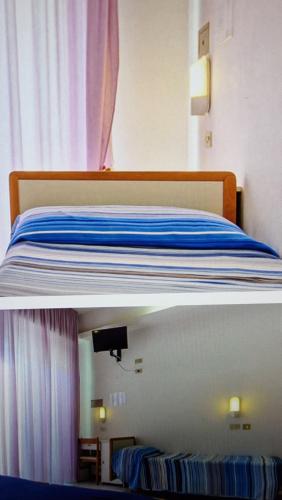 Cama o camas de una habitación en Hotel Saint Raphaele