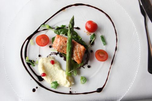 a plate of food with meat and vegetables on it at Jotunheimen Fjellstue in Boverdalen