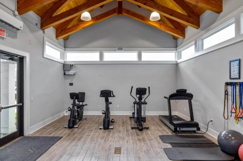 a gym with treadmills and exercise equipment in a room at The Gough Coast in Beaufort