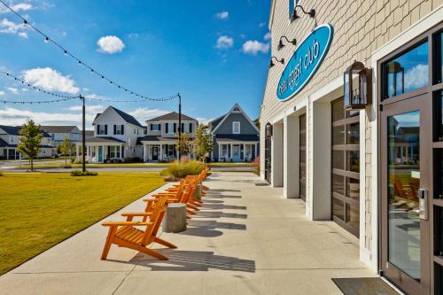 a row of benches sitting outside of a building at The Gough Coast in Beaufort
