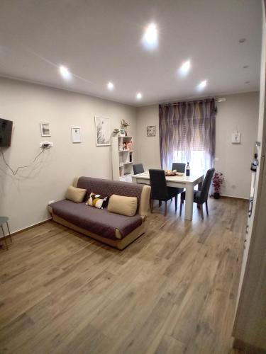 a living room with a couch and a table at Casa Nanna Edo in Celano