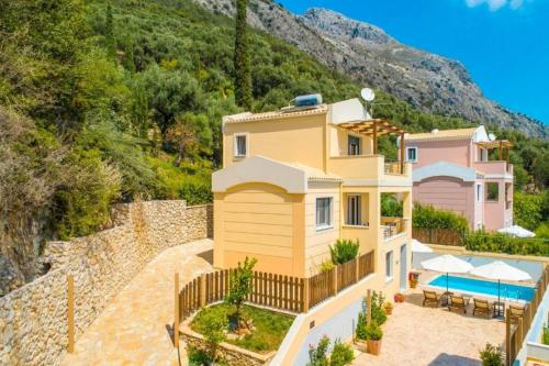 a villa with a view of a mountain at Corfu Sea View Villa - Sequoia in Barbati