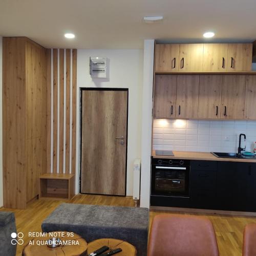 Kuchyň nebo kuchyňský kout v ubytování Grand Casa Apartments