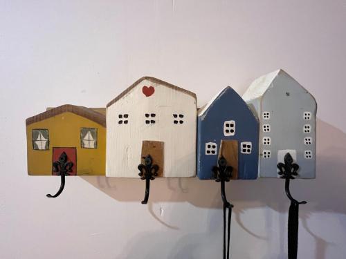 a group of houses on a shelf on a wall at Porta Pink in Budapest