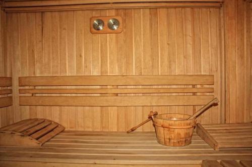 a sauna with a bucket in the middle of it at Predela 1 in Bansko