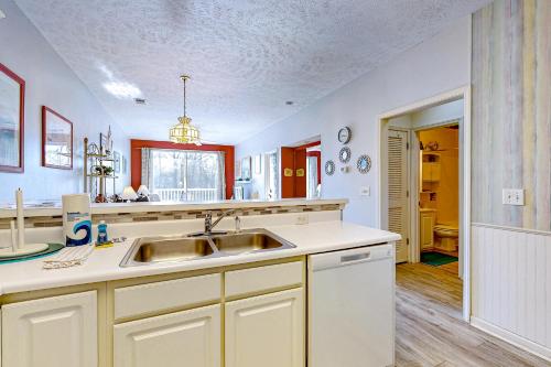 a kitchen with a sink and a counter top at Golfers Paradise in Myrtle Beach