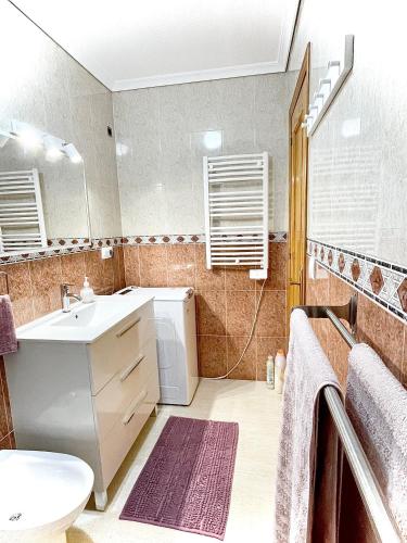 a bathroom with a sink and a toilet at Villa Dulce in Gran Alacant