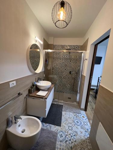 a bathroom with two sinks and a shower at Il Castello di Alberico in Cotignola