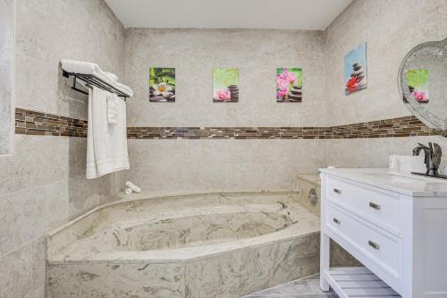 A bathroom at Spacious Villa in Coral Springs with Pool and Hot Tub!
