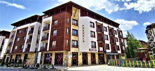 a large brick building on the side of a street at Predela 1 in Bansko
