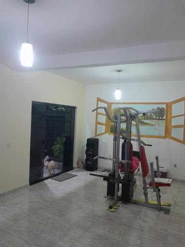 a room with a gym with a dog in it at Residencial in Salvador