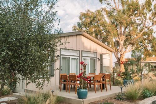 a house with a table and chairs in front of it at Ranch House at Galway Downs in Temecula