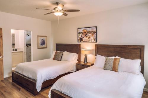 a bedroom with two beds and a ceiling fan at Ranch House at Galway Downs in Temecula
