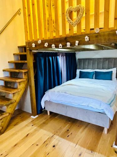 a bedroom with a bunk bed and a ladder at Glasgow Center/West End Apartment in Glasgow